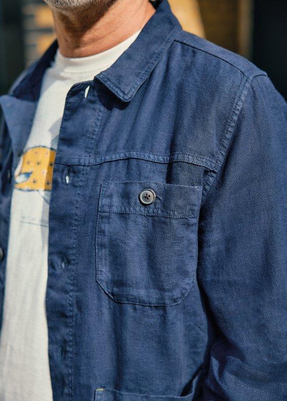 man in blue linen shirt